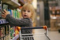 a child in the store buys food