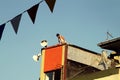 Child stranded on a terrace of a colorful house in Casablanca