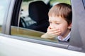 Child suffers from motion sickness in car Royalty Free Stock Photo