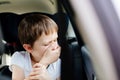 Child suffers from motion sickness in car Royalty Free Stock Photo