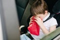 Child suffers from motion sickness in car Royalty Free Stock Photo