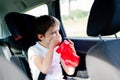 Child suffers from motion sickness in car Royalty Free Stock Photo