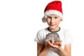 A child in a suit of Santa Claus holds a rat dumbo in his hands. White isolated background. Conceptual photo. Chinese New Year.