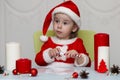 Child in a suit of Santa Claus writing a letter Royalty Free Stock Photo