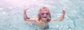 Child in summer swimming pool. Excited cute little boy in sunglasses in pool in sunny day. Banner for design header Royalty Free Stock Photo