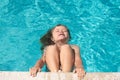 Child in summer swimming pool. Happy little kid boy playing with in outdoor swimming pool on hot summer day. Kids learn Royalty Free Stock Photo