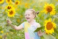 Child in sunflower field. Kids with sunflowers. Royalty Free Stock Photo
