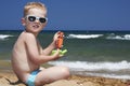Child in sunglasses on the beach. little boy near Royalty Free Stock Photo