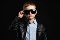 Child in sunglasses.fashionable handsome little boy in leather Royalty Free Stock Photo