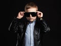 Child in sunglasses.fashionable handsome little boy in leather Royalty Free Stock Photo