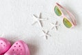 Child sunglasses on the sand, sea stars and shoes, beach mood