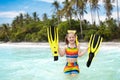 Child with swim fins snorkeling on tropical beach. Royalty Free Stock Photo