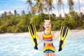 Child with swim fins snorkeling on tropical beach Royalty Free Stock Photo