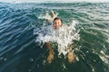 Child swim in the sea and have fun. Royalty Free Stock Photo