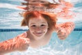 Child swim under water in sea. Kid swimming in pool underwater. Happy boy swims in sea underwater. Children in water. Royalty Free Stock Photo