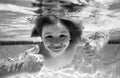 Child swim under water in sea. Kid swimming in pool underwater. Happy boy swims in sea underwater. Children in water. Royalty Free Stock Photo