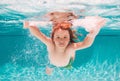 Child swim under water in sea. Kid swimming in pool underwater. Happy boy swims in sea underwater. Children in water Royalty Free Stock Photo
