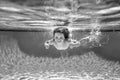 Child swim under water in sea. Kid swimming in pool underwater. Happy boy swims in sea underwater, active kid swimming Royalty Free Stock Photo