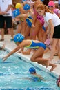 Child Swimmer Leaps Into Pool In Relay Race