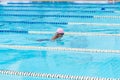 child swimmer swim in swimming pool. Water sports and competition, learning to swim classes for children