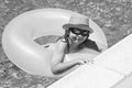 Child in swimming pool on inflatable ring. Kid swim with orange float. Kids beach fun. Royalty Free Stock Photo