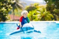 Child in swimming pool. Kid on inflatable float Royalty Free Stock Photo