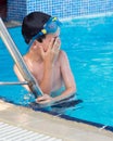 Child at swimming pool steps Royalty Free Stock Photo