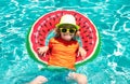 Child in swimming pool. Summer activity. Healthy kids lifestyle. Child swim in summer pool water.