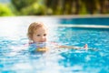 Child in swimming pool. Summer vacation with kids. Royalty Free Stock Photo