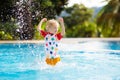 Child in swimming pool. Summer vacation with kids. Royalty Free Stock Photo