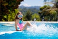 Child in swimming pool. Summer vacation with kids. Royalty Free Stock Photo