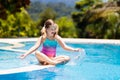 Child in swimming pool. Summer vacation with kids. Royalty Free Stock Photo