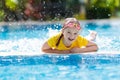 Child in swimming pool. Summer vacation with kids Royalty Free Stock Photo