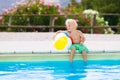 Child in swimming pool on summer vacation Royalty Free Stock Photo