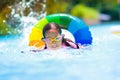 Child in swimming pool on toy ring. Kids swim Royalty Free Stock Photo