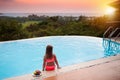 Child at swimming pool at sunset. Kid at sea. Royalty Free Stock Photo