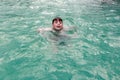 Child swimming in warm thermal pool