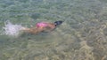 Child swims in the sea.