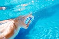 Child swims underwater in swimming pool Royalty Free Stock Photo