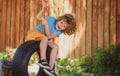 Child swing on backyard. Kid playing oudoor. Happy cute little boy swinging and having fun healthy summer vacation Royalty Free Stock Photo