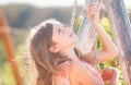 Child swing on backyard. Kid playing oudoor. Happy cute little girl swinging and having fun healthy summer vacation Royalty Free Stock Photo