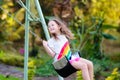 Child swinging on playground. Kids swing Royalty Free Stock Photo