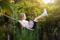 Child swinging on playground. Kids swing Royalty Free Stock Photo