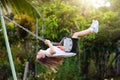 Child swinging on playground. Kids swing Royalty Free Stock Photo