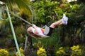 Child swinging on playground. Kids swing Royalty Free Stock Photo