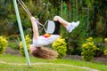 Child swinging on playground. Kids swing Royalty Free Stock Photo