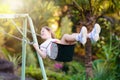 Child swinging on playground. Kids swing Royalty Free Stock Photo