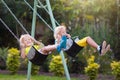 Child swinging on playground. Kids swing Royalty Free Stock Photo