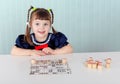 Child at table played with bingo