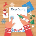 Child at table writing a letter to Santa Claus wish list. Vector flat. Royalty Free Stock Photo